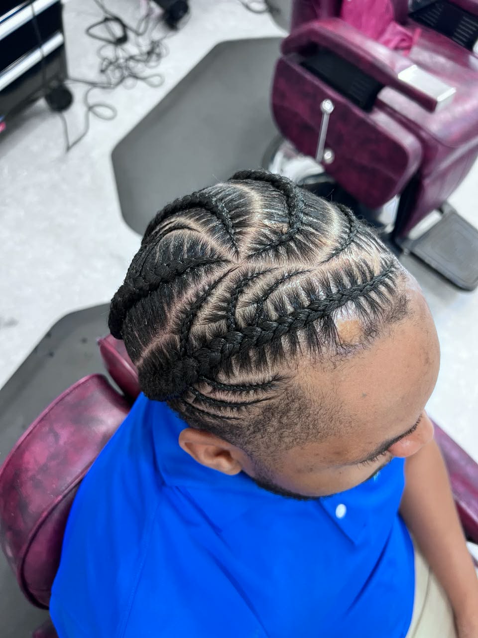 Curved stitch cornrows with a clean taper